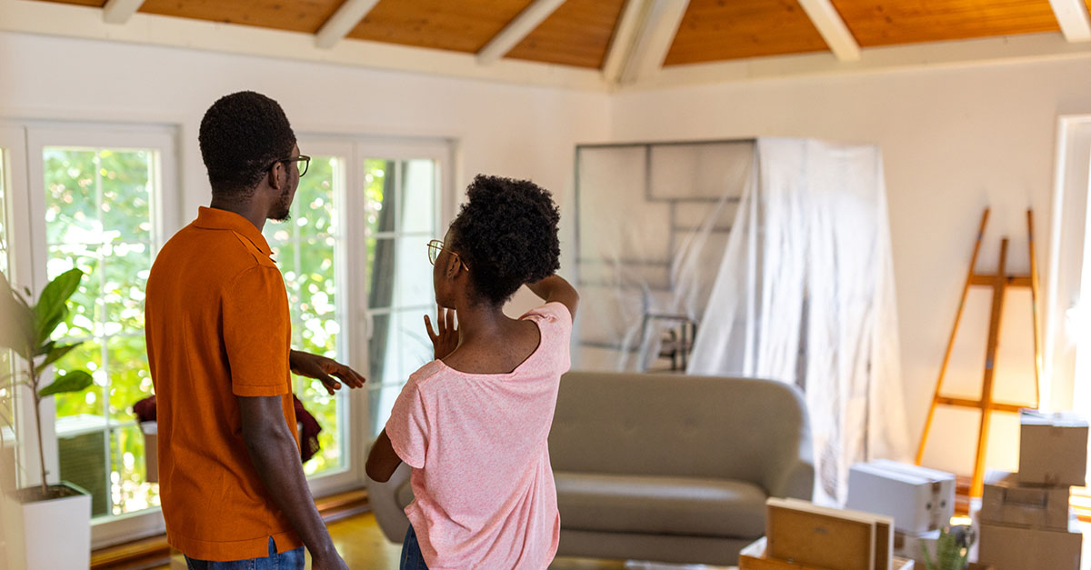 A young couple moving into a new home